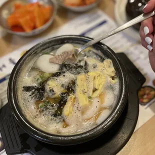 Gomtang ttkeoguk (rice cake soup, lots of meat) and comes with a side of rice