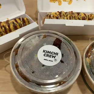 a variety of hotdogs in boxes