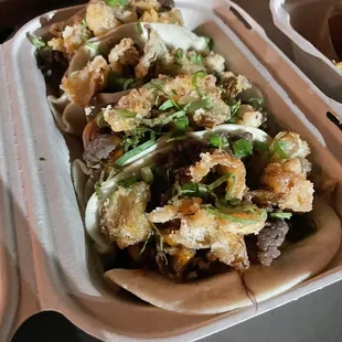 a close up of a sandwich in a styrofoam container