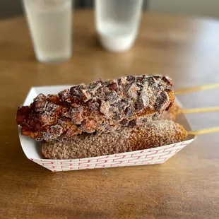 Corn dog with a dusting of sugar.