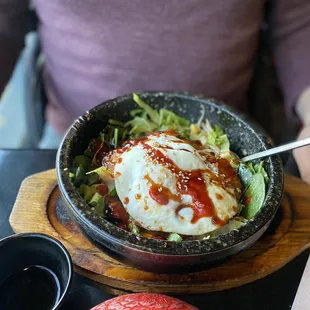 a person eating a bowl of food