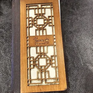 The bill comes in a fancy wooden folder!