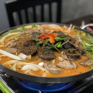 a bowl of beef and vegetable soup