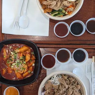 Spicy rice cakes, purple rice chicken bowl, noodle chicken bowl with egg