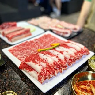 a variety of meats on a table