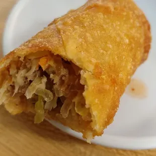 Housemade korean eggrolls. Stuffed w peppery soy jap chae blend w veggies. If fresh, delicious. oil is not hot enough so grows soft w time