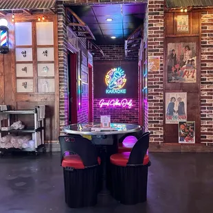 Karaoke rooms, restaurant decor, dining table for four.