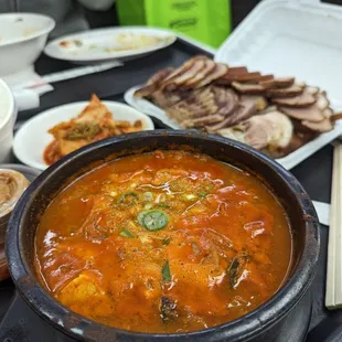 #15 ttukbaegi gopchang (beef small intestine soup) with small jokbal in the back