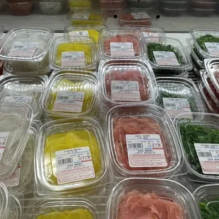 a variety of fresh vegetables in plastic containers