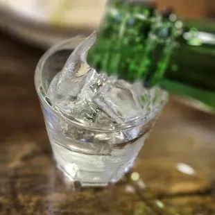 a bottle of wine being poured into a glass