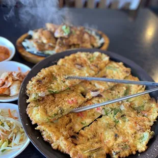 a plate of food with chopsticks