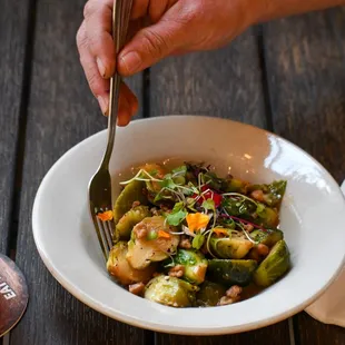 a bowl of food and a drink