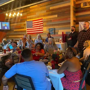 a large group of people seated around a table