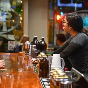 a man and a woman at a bar