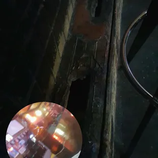 The boot step (below the bar) is either termite consumed or well used.