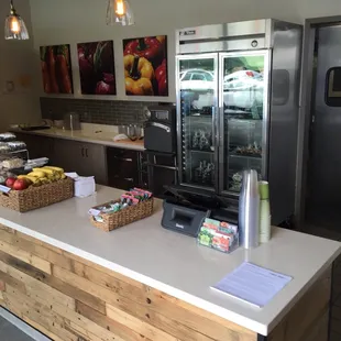 a kitchen with a counter and refrigerator