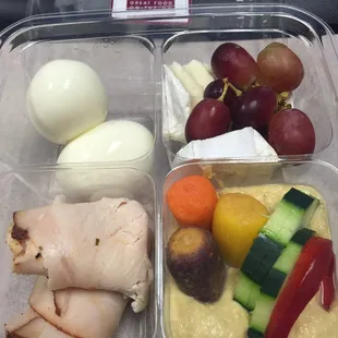 Protein Box. Boiled eggs, grapes, cheese, turkey, and hummus with veggies. So good and so filling too!