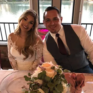 Beautiful centerpiece. Lots of greenery with a touch of color. Just what I asked for