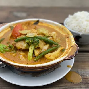 Curry Vegetables Chef&apos;s signature vegetarian dish, broccoli, cabbage, onion, tomatoes, string bean, eggplant and tofu puff