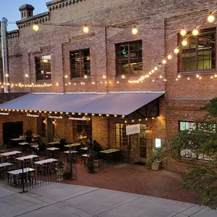 the outside of a restaurant at dusk