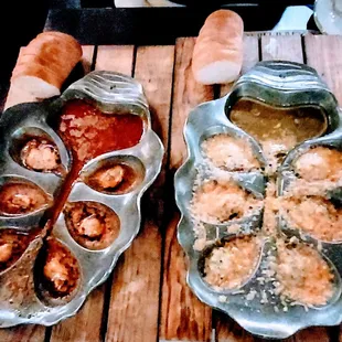 two pans of food on a wooden table