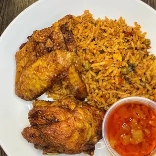 Jollof Rice with fried chicken - halal. The chicken is so well seasoned &amp; crispy, yet juicy on the inside!