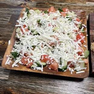 a pizza with cheese and tomatoes