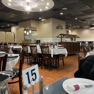 empty dining room with tables and chairs