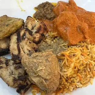 Buffet plate; top of plate going clockwise  Beef keema  Butter chicken Chicken biryani Chicken korma  Chicken tikka  Chicken chapli kabob