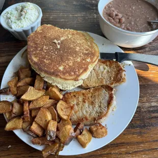 Pork loins, grilled. Fried potatoes, soup beans, cornbread, and slaw.