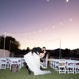 Beneath the dreamy purple Las Vegas sky, this couple shares a romantic kiss on our lakeside dock.