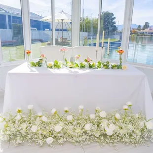 Soft pastels, fresh flowers, and dreamy natural light create the perfect romantic setting.