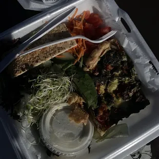 a meal in a styrofoam container