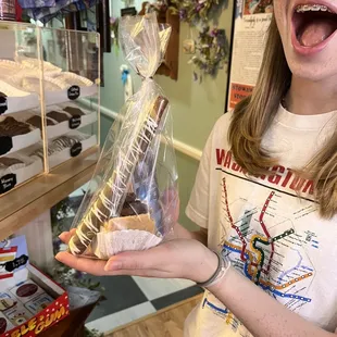 a woman holding a bag of food