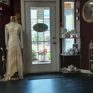 a tea room with a table and chairs