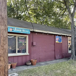 a red building with a sign for a restaurant