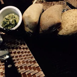Assorted breads with herbed spread.