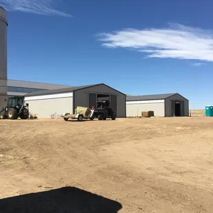 The barns where the box stalls are and indoor riding arena.