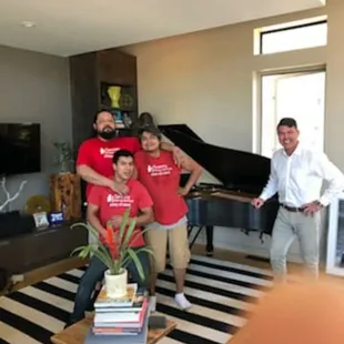 Baby grand piano moved successfully and a happy photo afterwards