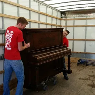 Here are the guys moving a upright piano.