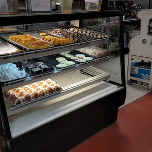 a display case filled with donuts