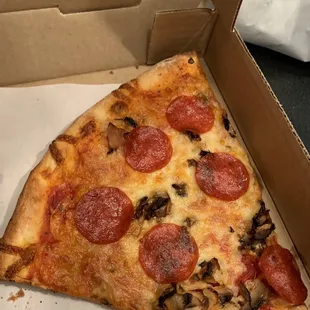 a slice of pizza in a box