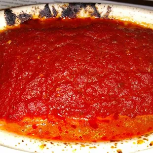 Delicious baked lasagna hidden beneath the freshest tomato sauce