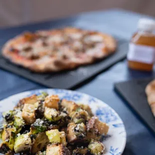 Roasted brussels Caesar, Castelvetrano olives, focaccia croutons at Serious Pie - Downtown Seattle location