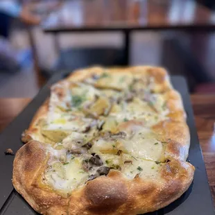 Truffle mushroom pizza with Yukon potato.