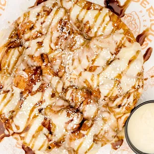 Seriously Sweet Dessert- famous dough, twisted, basted in cinnamon sugar and served with cream cheese icing