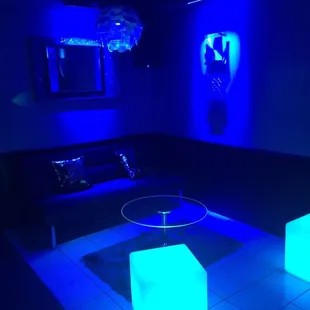 a living room with blue lighting
