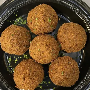 a plate of fried meatballs