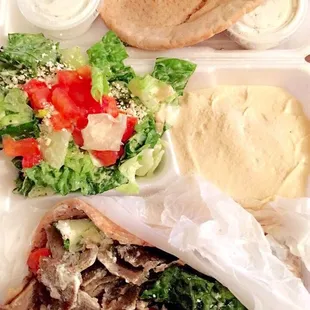 Gyro on wheat with hummus and wheat pits bread with Greek feta salad.