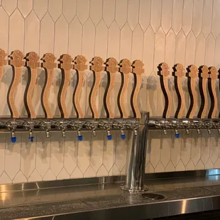 Each one of the Pour Handles shaped liked serpents